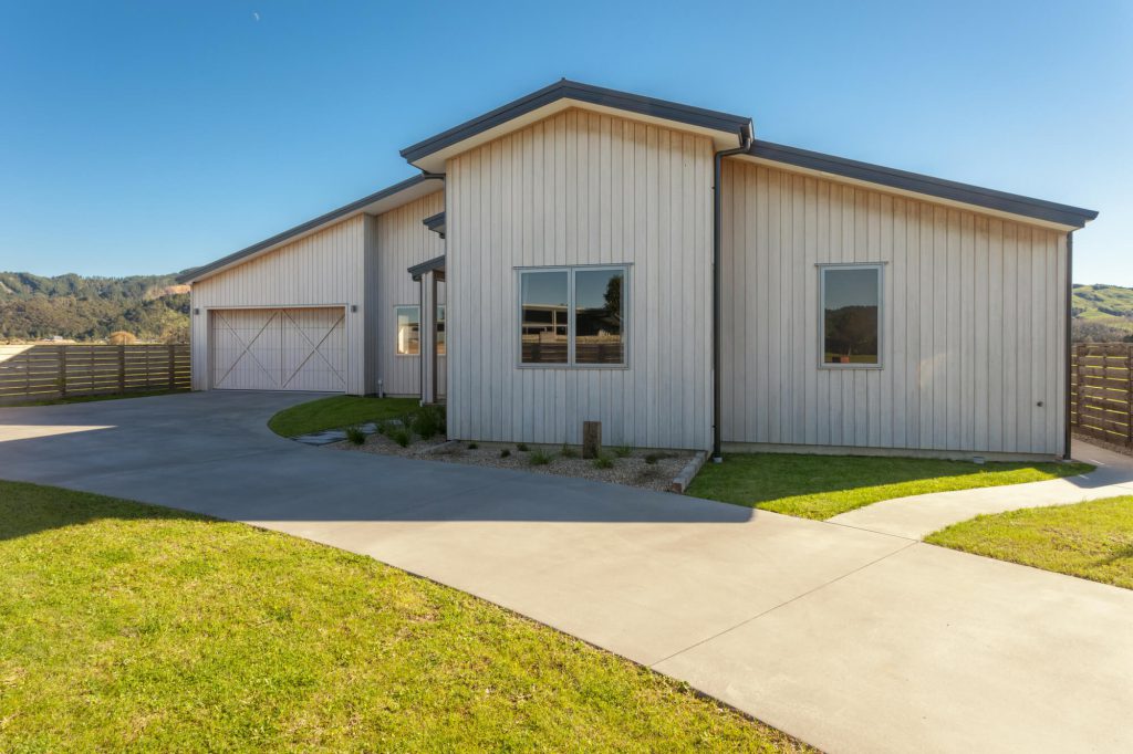 Flying-Into-Whitianga-Vulcan-Cladding-Abodo-Wood