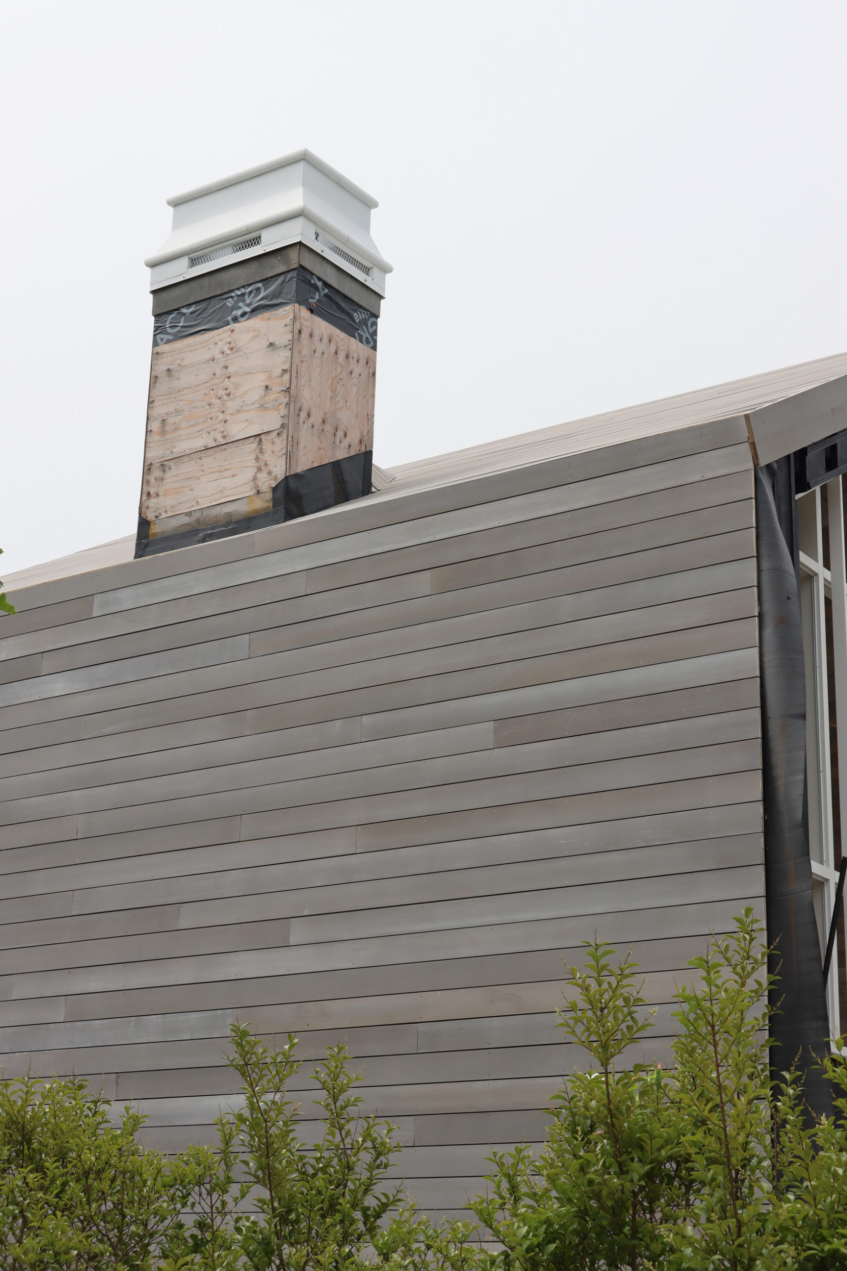 Greenwich Cove Residence featuring WILLIWAW weathered Alaskan Yellow Cedar Exterior Siding, Interior Cladding, and Roof Cladding