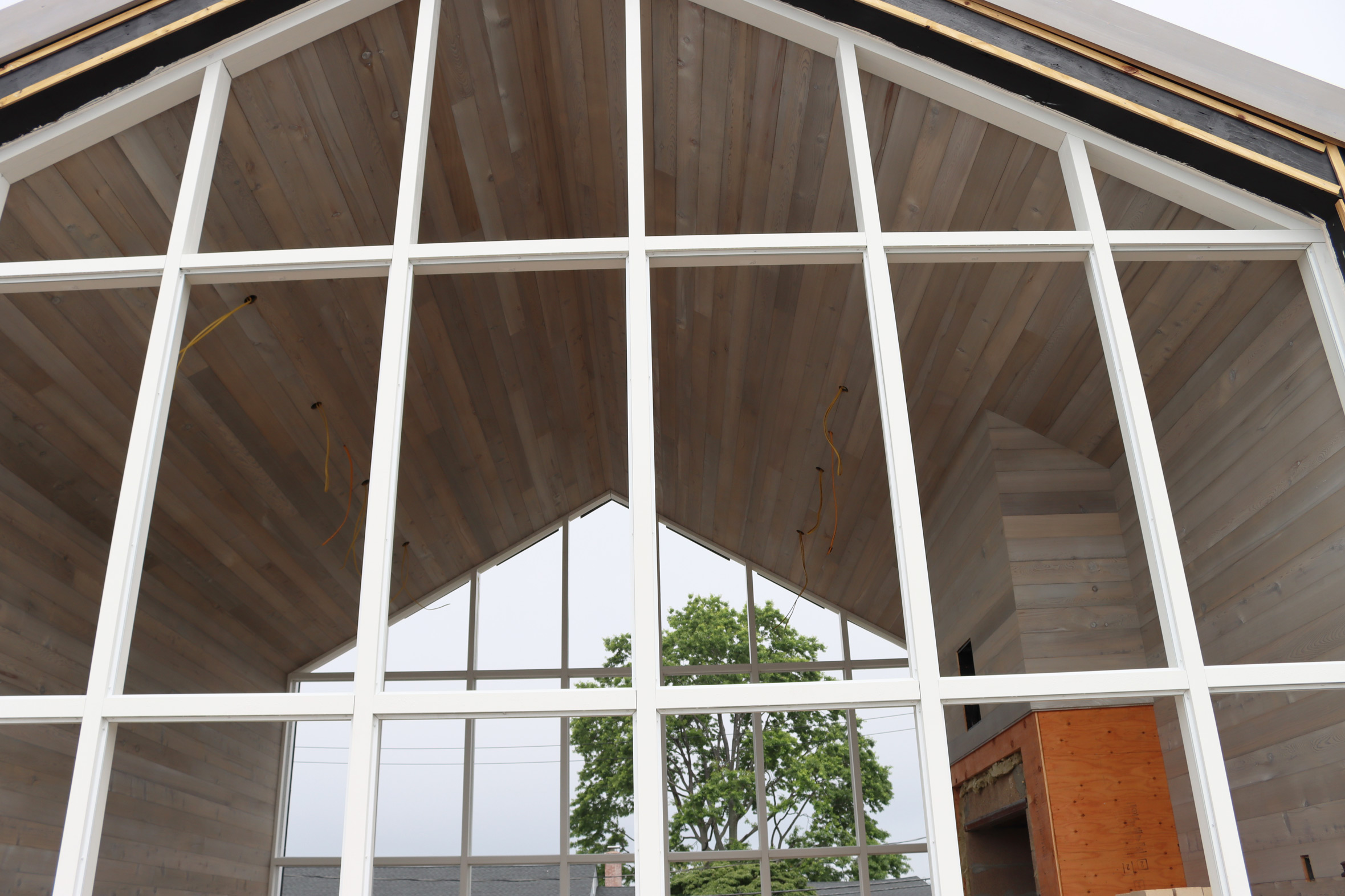 Greenwich Cove Residence featuring WILLIWAW weathered Alaskan Yellow Cedar Exterior Siding, Interior Cladding, and Roof Cladding